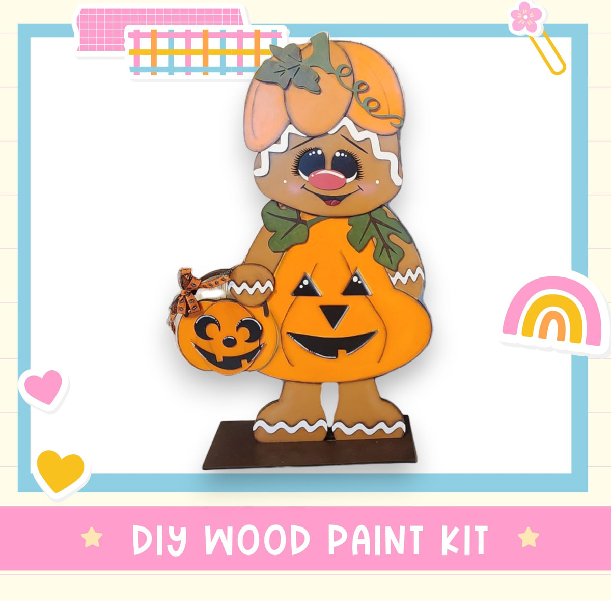 a wooden cutout of a dog holding a pumpkin