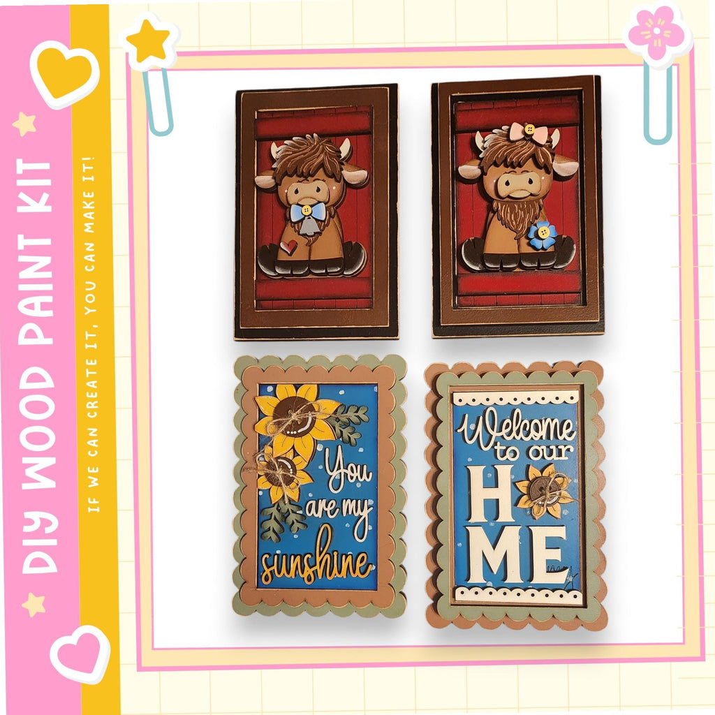 four wooden frames with various designs and text, including a cow, a sunflower, a welcome sign, and a heart.
