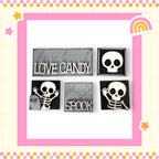 four black and white skull-shaped objects with text on them, arranged in a square frame with a pink border.