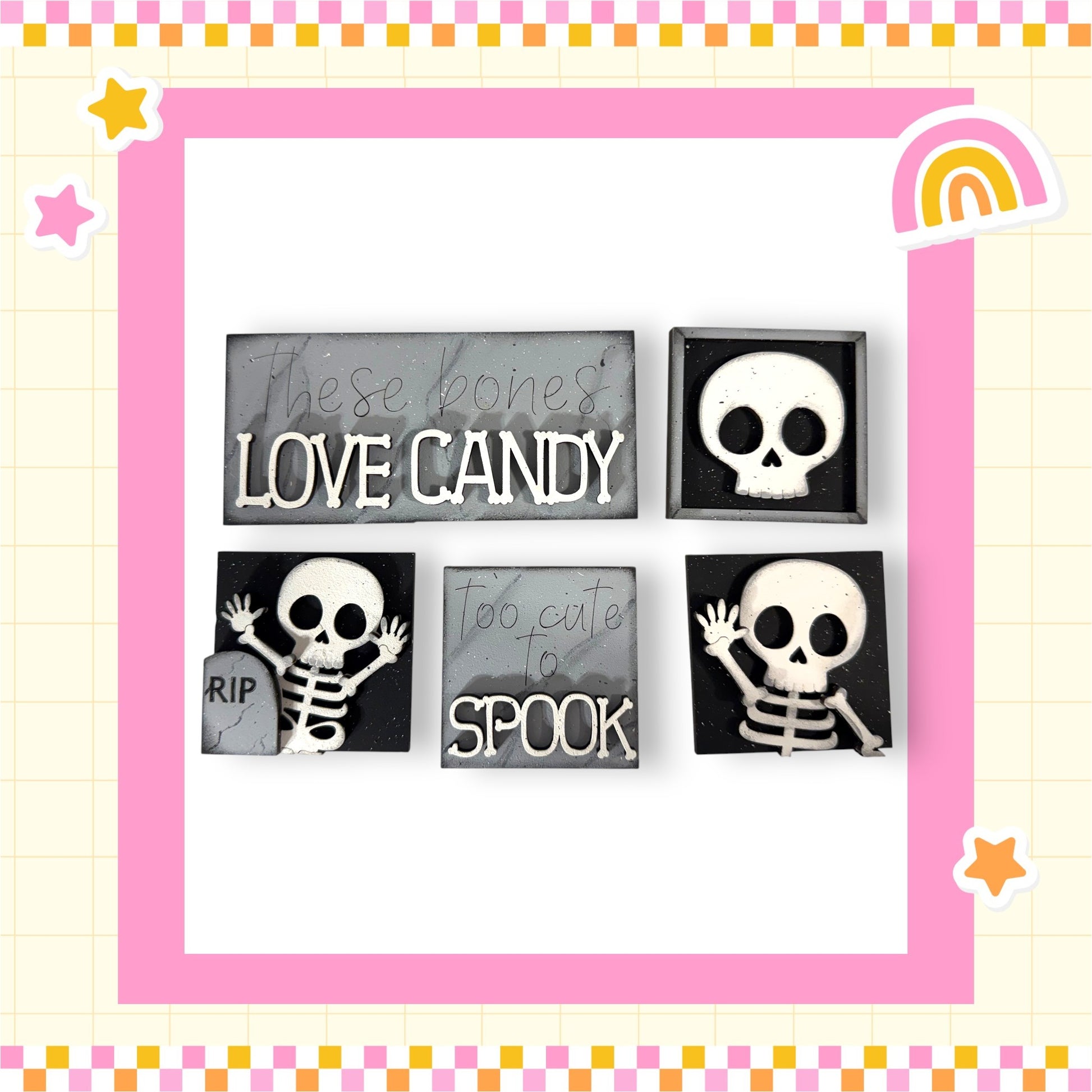 four black and white skull-shaped objects with text on them, arranged in a square frame with a pink border.