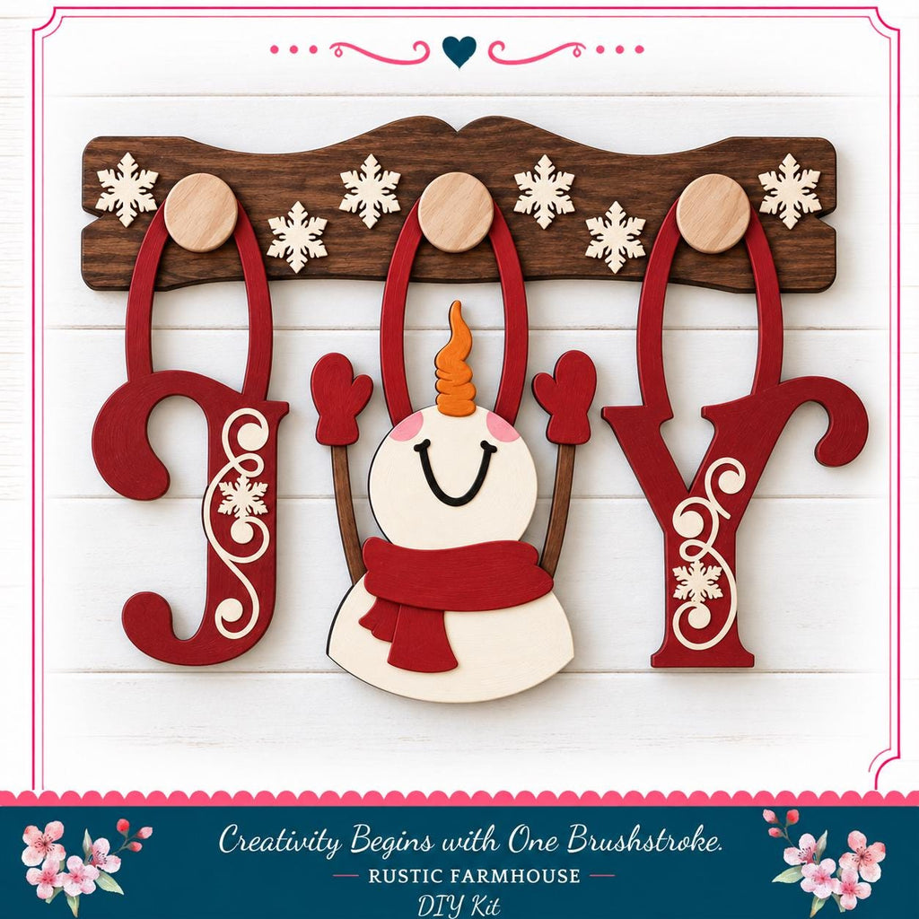 A wooden snowman decoration with the word "JOY" made of wooden letters, surrounded by snowflakes and a red scarf.