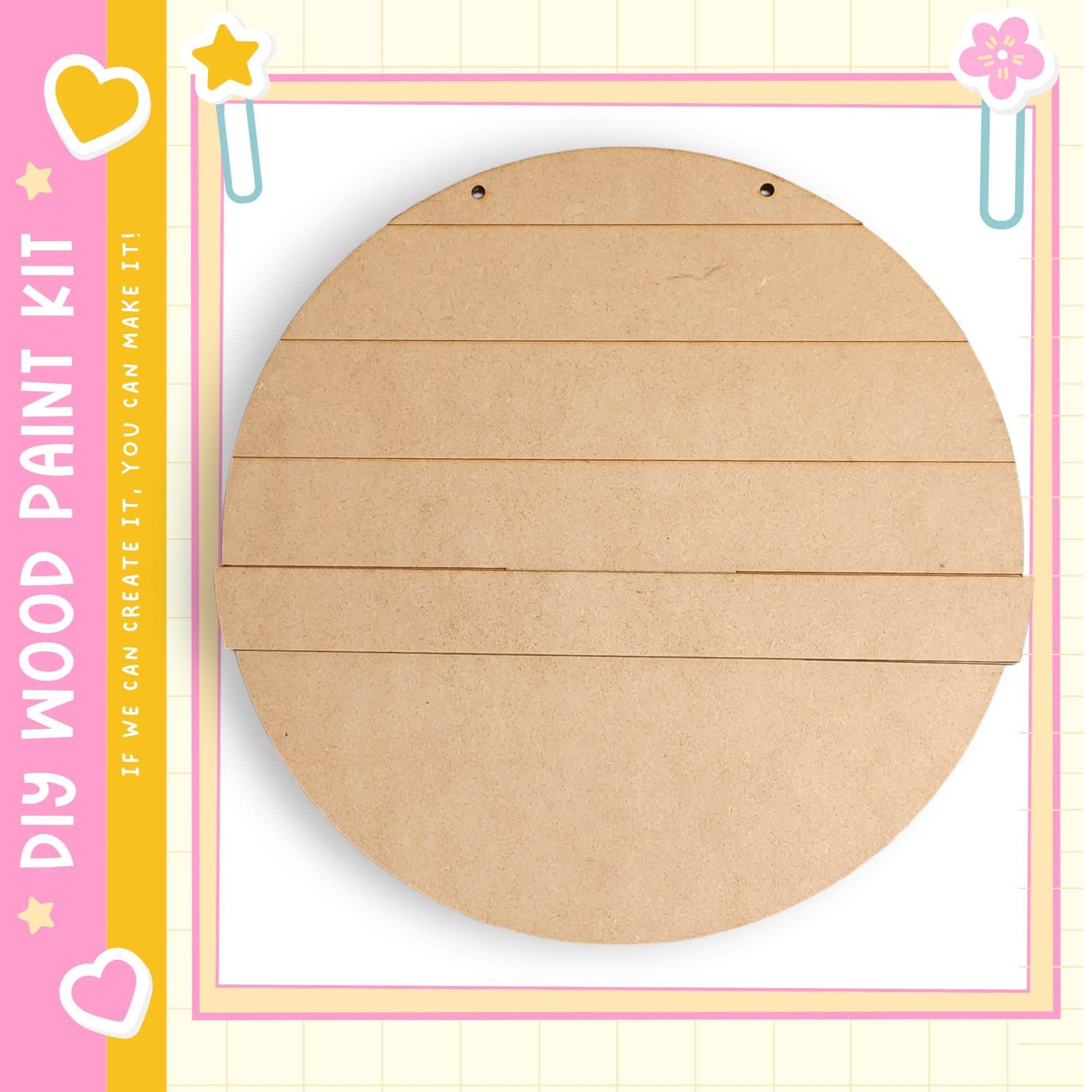 a large, empty, circular piece of wood with a grid-like pattern on it, placed against a pink and yellow background with a heart and star motif.