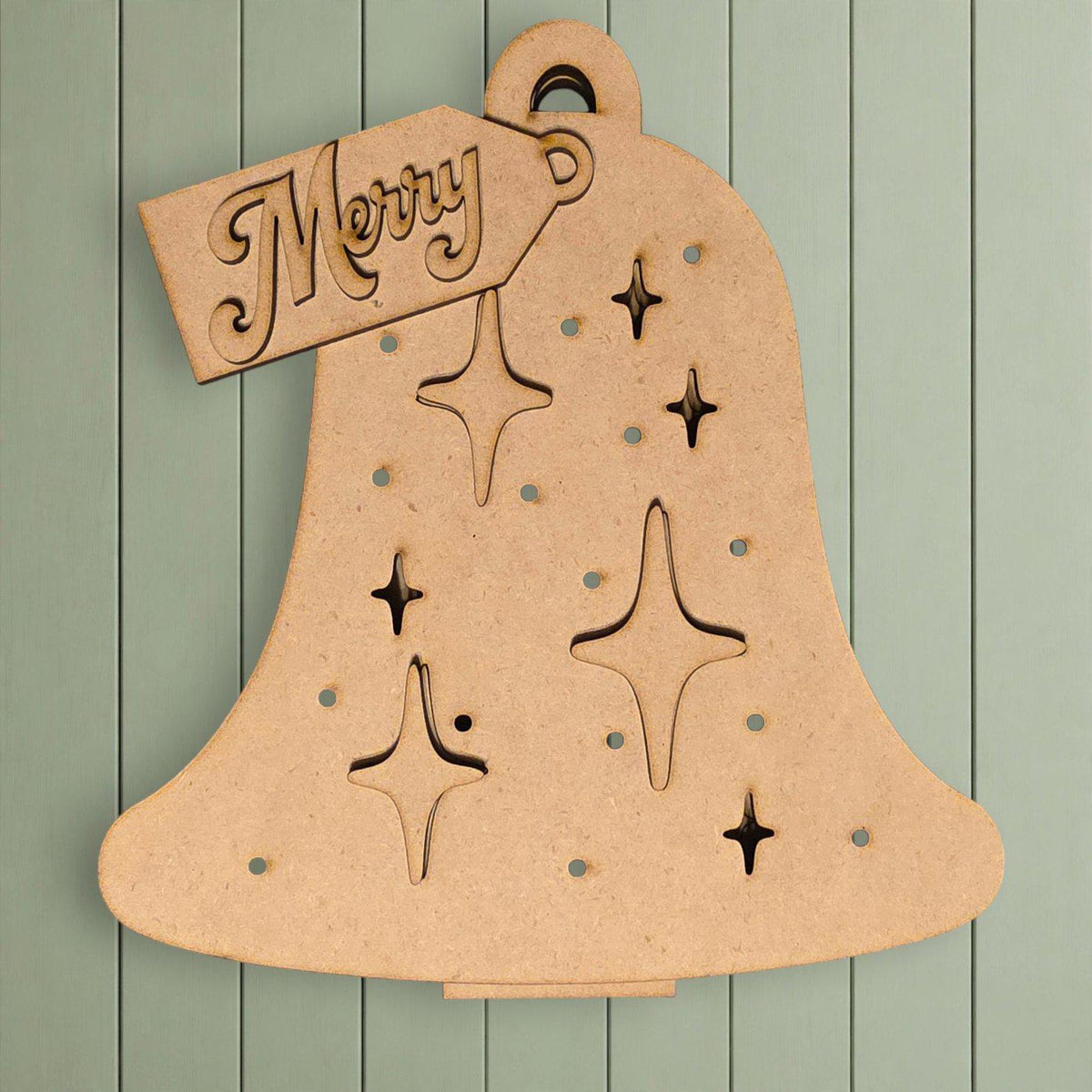 A wooden bell ornament with star-shaped cutouts and a "Merry" tag attached to it.