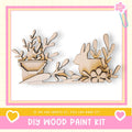 The image is a DIY wood paint kit featuring a wooden rabbit and plant decoration.
