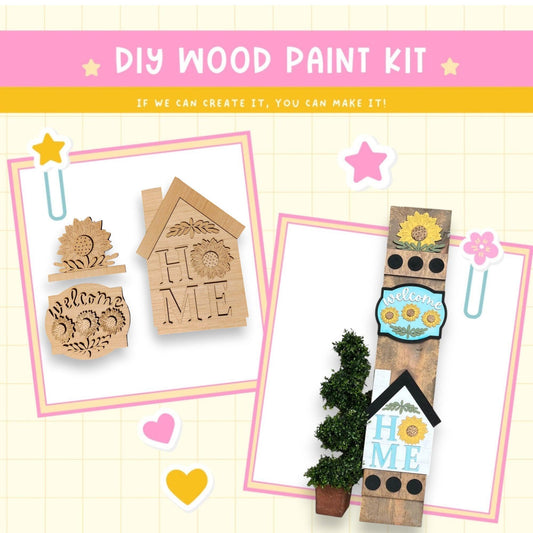 a wooden craft kit with a house and a tree