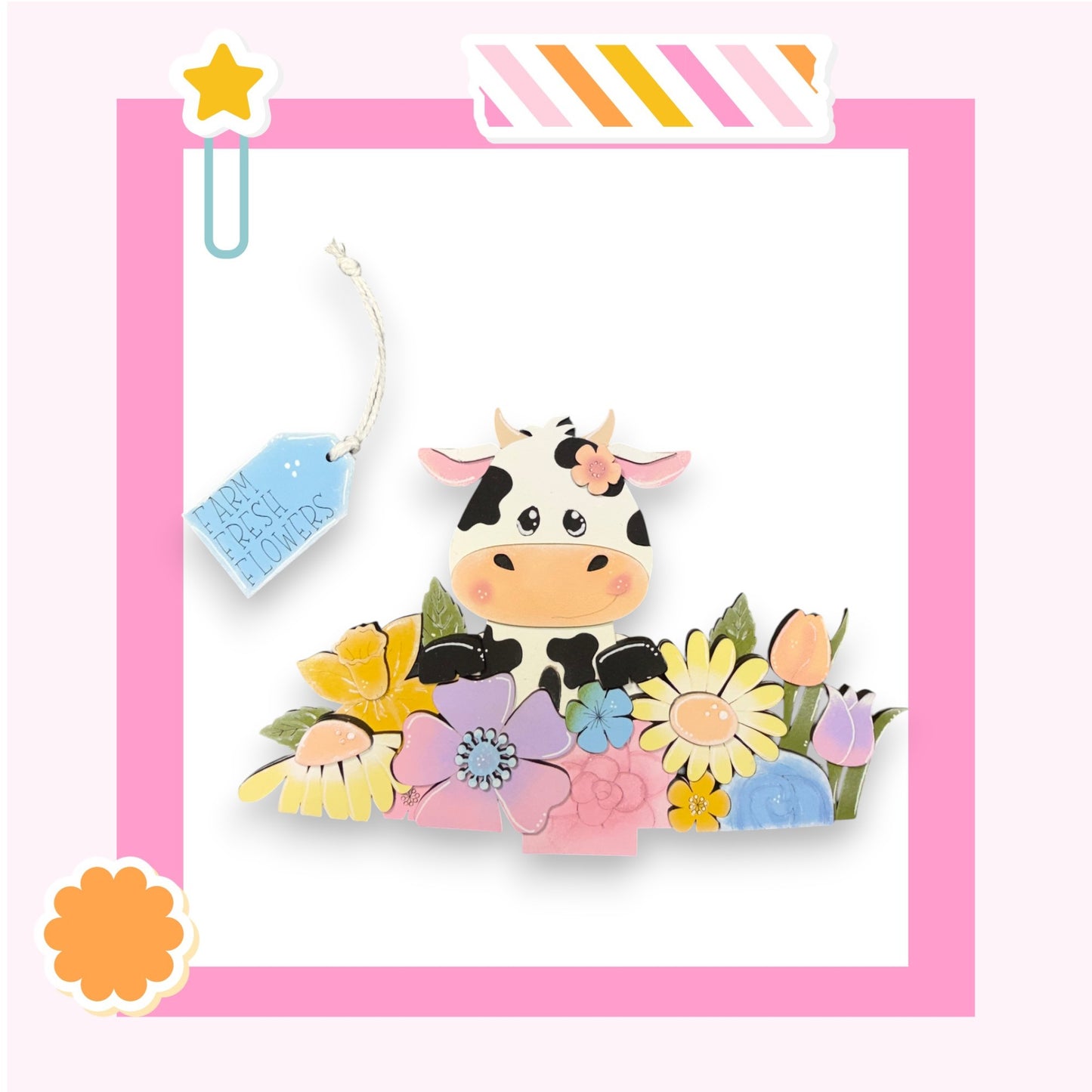 A colorful illustration of a cow surrounded by a variety of flowers and plants, with a pink border framing the scene.