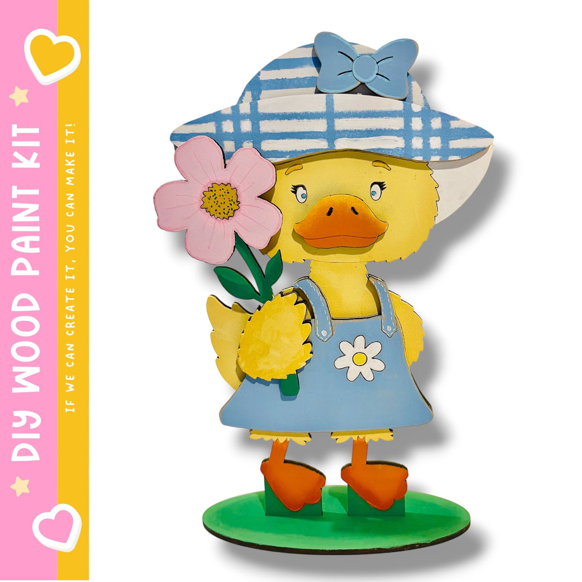 A wooden toy duck holding a pink flower and wearing a blue and white striped hat.