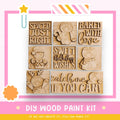 The image is a DIY wood paint kit featuring various wooden shapes and characters, including a star, a gingerbread man, and a cat.