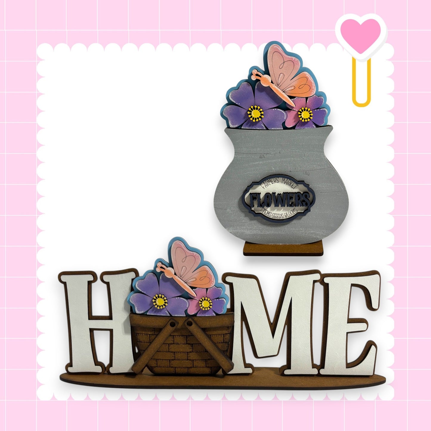 a wooden sign with the word "HOME" written on it, surrounded by decorative elements such as flowers and butterflies.