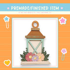 a card with a picture of a lantern and flowers