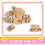 The image is a DIY wood paint kit featuring a wooden bear and flowers, with a tag that says "WALK UP AND SMELL THE FLOWERS".