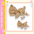 two wooden duck figures, one larger and one smaller, set against a pink and yellow background.