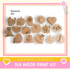a DIY wood paint kit with various wooden shapes and designs, including a turkey, pumpkin, sun, heart, and other festive ornaments, as well as a bird and a flower.