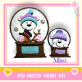 a DIY wood paint kit for creating a winter wonderland-themed snow globe. The kit includes a snow globe with a bear wearing a hat and a miniature snow globe with a bear wearing a hat. The kit is designed to allow users to create their own winter wonderland-themed snow globes.