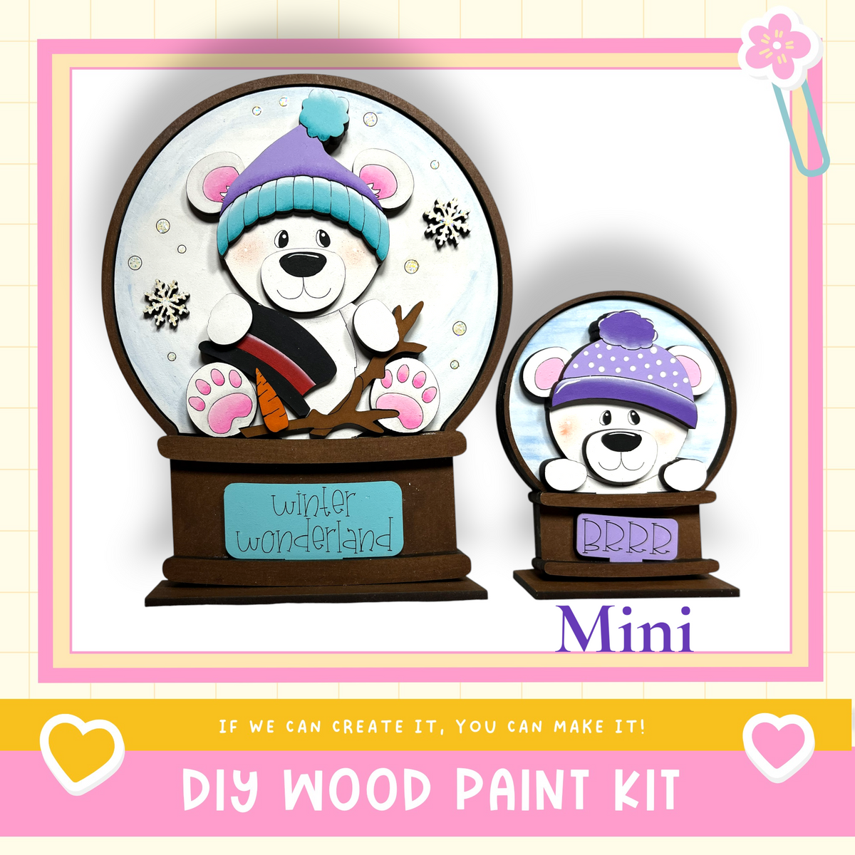 a DIY wood paint kit for creating a winter wonderland-themed snow globe. The kit includes a snow globe with a bear wearing a hat and a miniature snow globe with a bear wearing a hat. The kit is designed to allow users to create their own winter wonderland-themed snow globes.