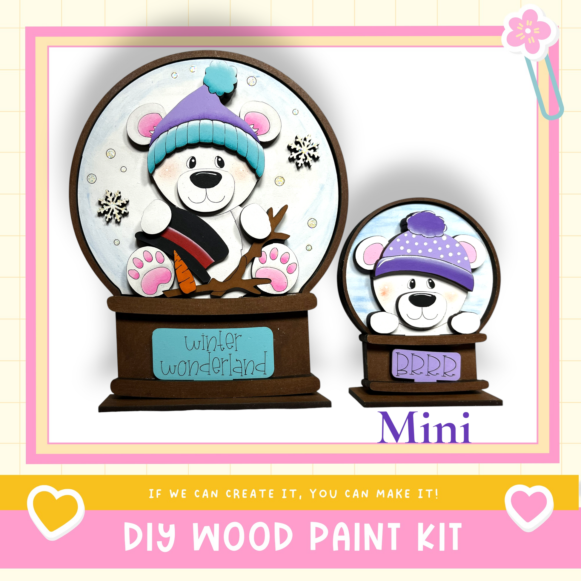 a DIY wood paint kit for creating a winter wonderland-themed snow globe. The kit includes a snow globe with a bear wearing a hat and a miniature snow globe with a bear wearing a hat. The kit is designed to allow users to create their own winter wonderland-themed snow globes.