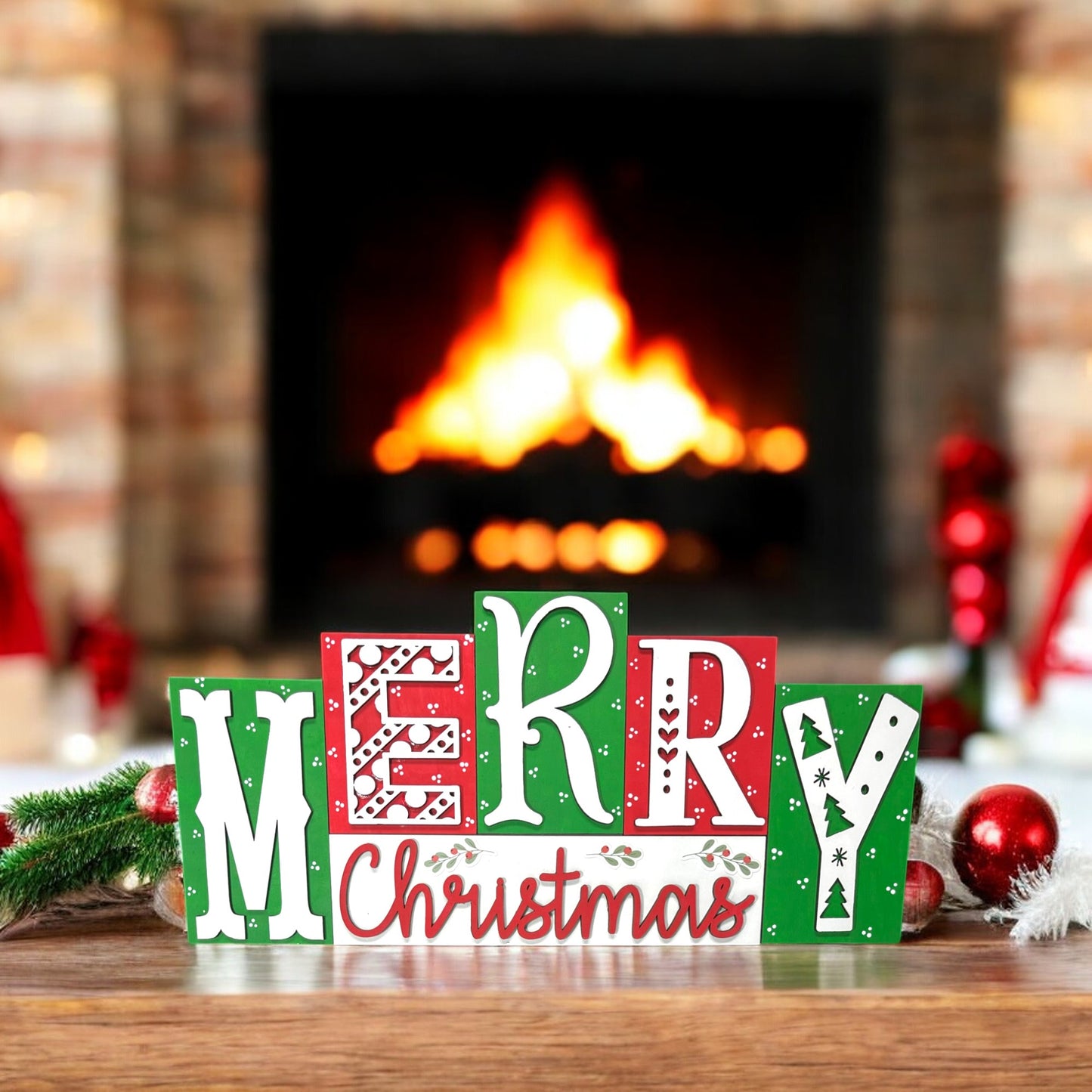 a wooden block that says merry christmas in front of a fireplace