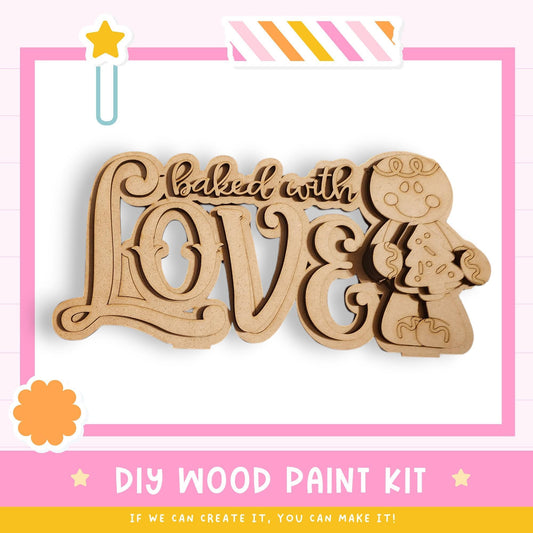 a DIY wood paint kit for creating a wooden sign with the phrase "baked with love".