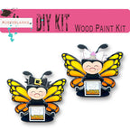 a pair of yellow and black butterfly pin badges