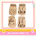 The image is a DIY wood paint kit featuring four wooden mason jars with various animal faces and designs carved into them.
