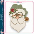 A wooden Santa Claus figure with a green hat and red berries, along with a button on his left ear.