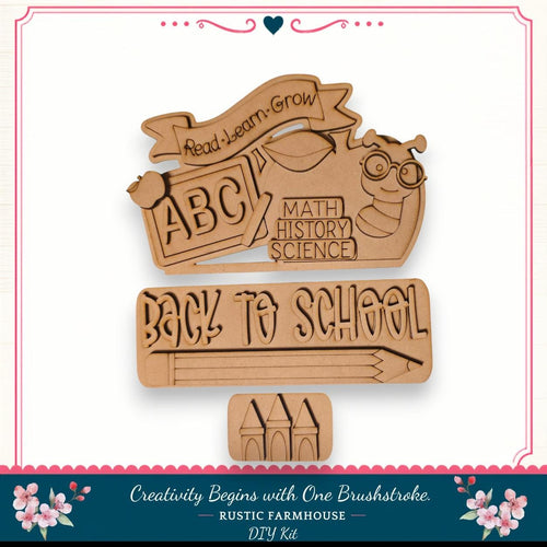 The image is a DIY kit for creating a "Back to School" sign, featuring a wooden cutout with the text "Back to School" and a bee. The kit includes a wooden stick figure and a wooden castle, which are used to create the sign. The kit is designed to encourage creativity and learning, as indicated by the "Read Learn Grow" banner and the "Back to School" message.