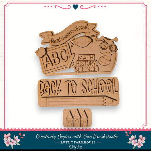 The image is a DIY kit for creating a "Back to School" sign, featuring a wooden cutout with the text "Back to School" and a bee. The kit includes a wooden stick figure and a wooden castle, which are used to create the sign. The kit is designed to encourage creativity and learning, as indicated by the "Read Learn Grow" banner and the "Back to School" message.
