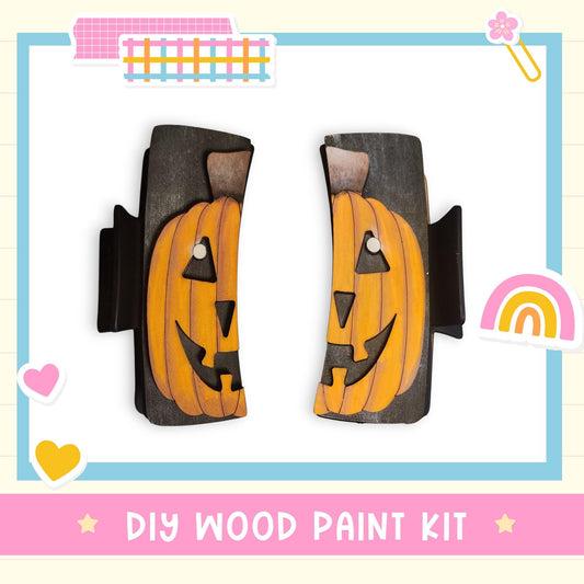 a DIY wood paint kit with two carved pumpkin-shaped pieces, one on each side, set against a white background.