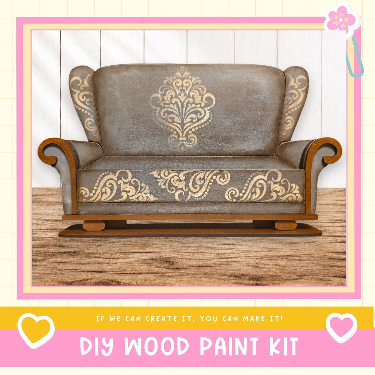 a large, ornate wooden chair with intricate designs painted on it. The chair is placed on a wooden floor against a white wall. The image includes text that reads "DIY WOOD PAINT KIT" and "If we can create it, you can make it!"