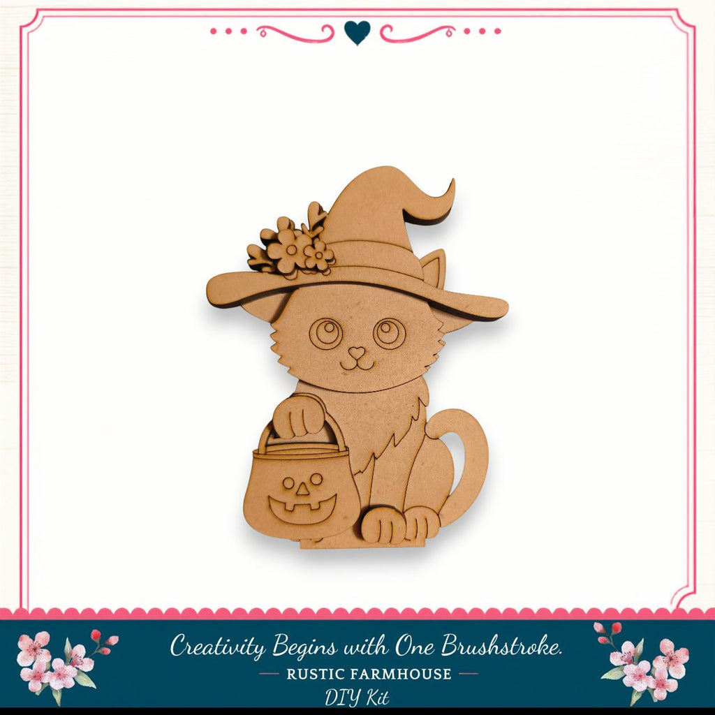 A wooden cat wearing a witch's hat and carrying a carved pumpkin, set against a white background with a decorative border.
