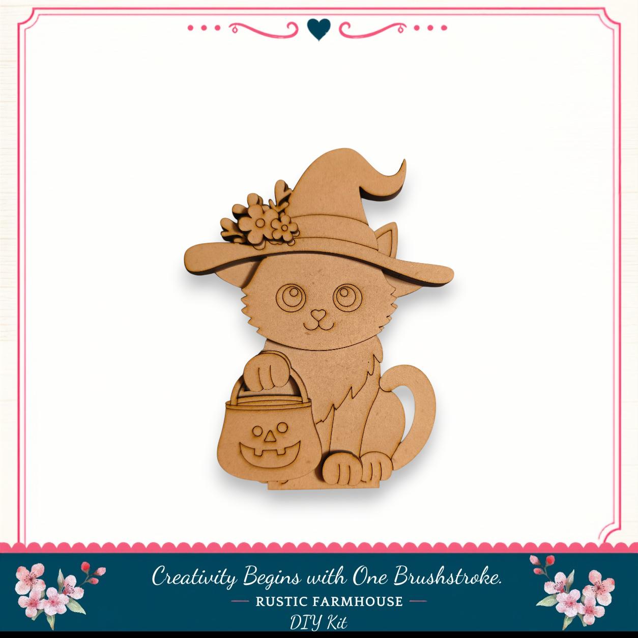 A wooden cat wearing a witch's hat and carrying a carved pumpkin, set against a white background with a decorative border.