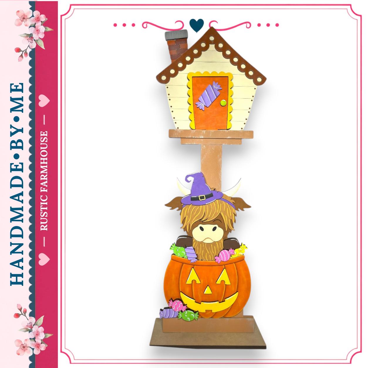 A whimsical Halloween-themed mailbox with a pumpkin-shaped mailbox and a small animal figure inside.