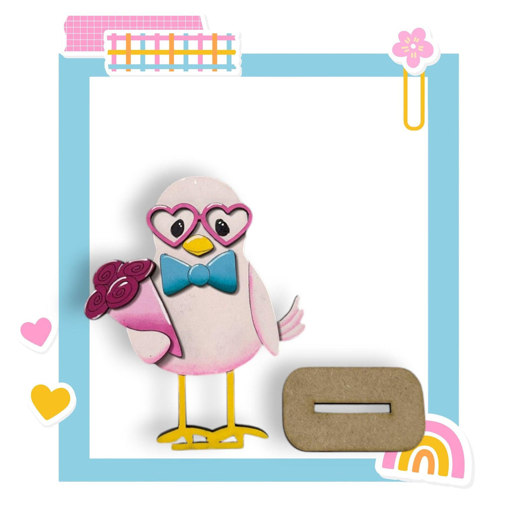 a picture frame with a bird wearing glasses and a bow tie
