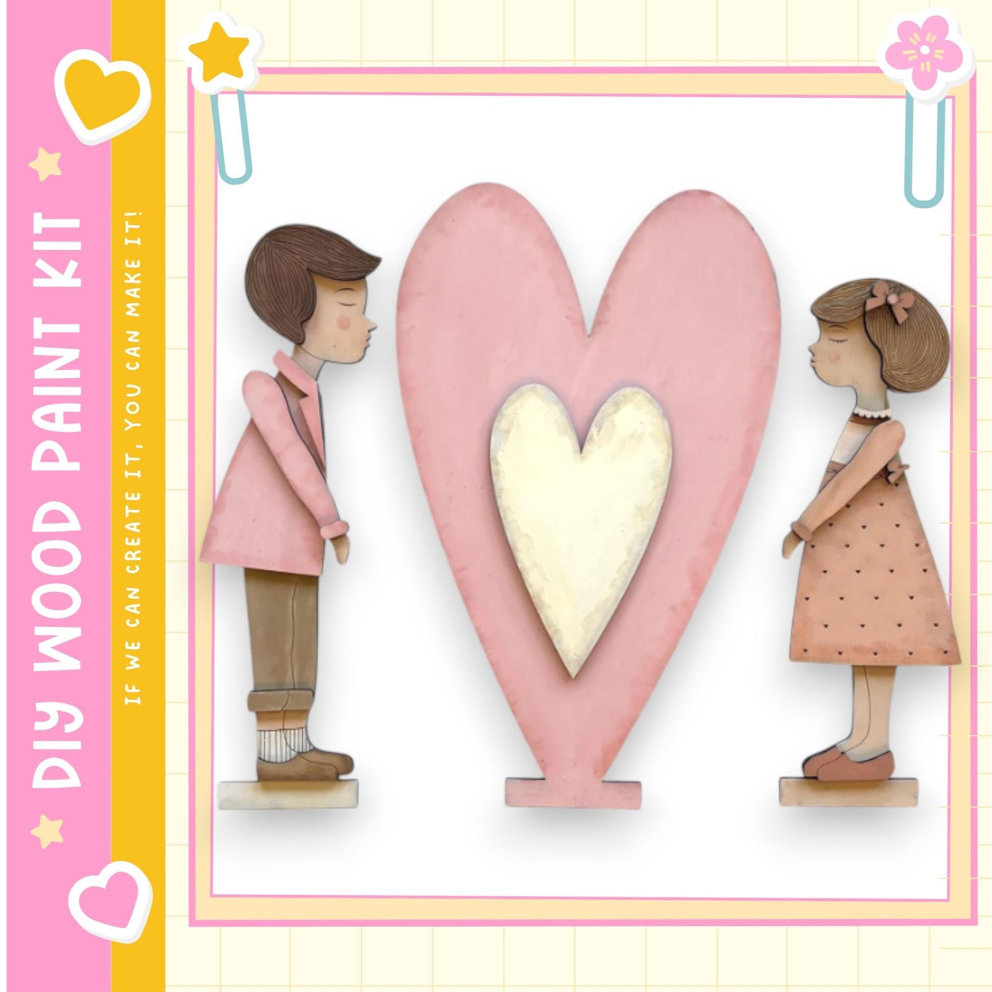 two wooden figures, a boy and a girl, standing next to a large pink heart.