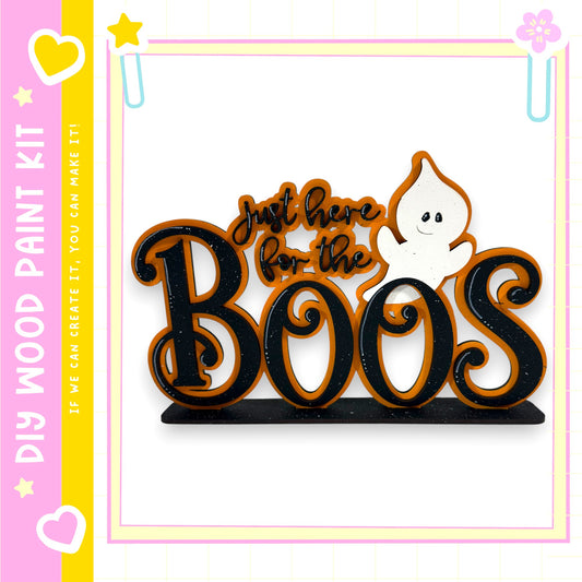 A Halloween-themed sign with the text "Just here for the BOOs" and a ghost character.