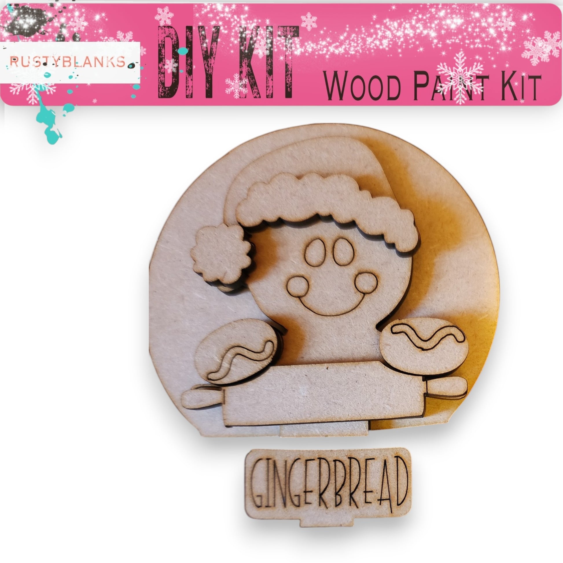 a wooden gingerbread cookie-like figure with a smiling expression, along with a pink banner that reads "DIY KIT" and "WOOD PAINT KIT".