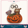 A Halloween-themed DIY kit featuring a ghost, a cat, and a carved pumpkin.