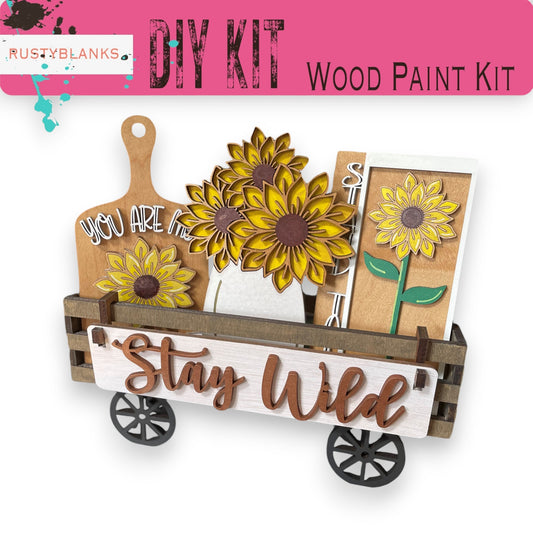 a wooden paint kit with sunflowers in a wagon