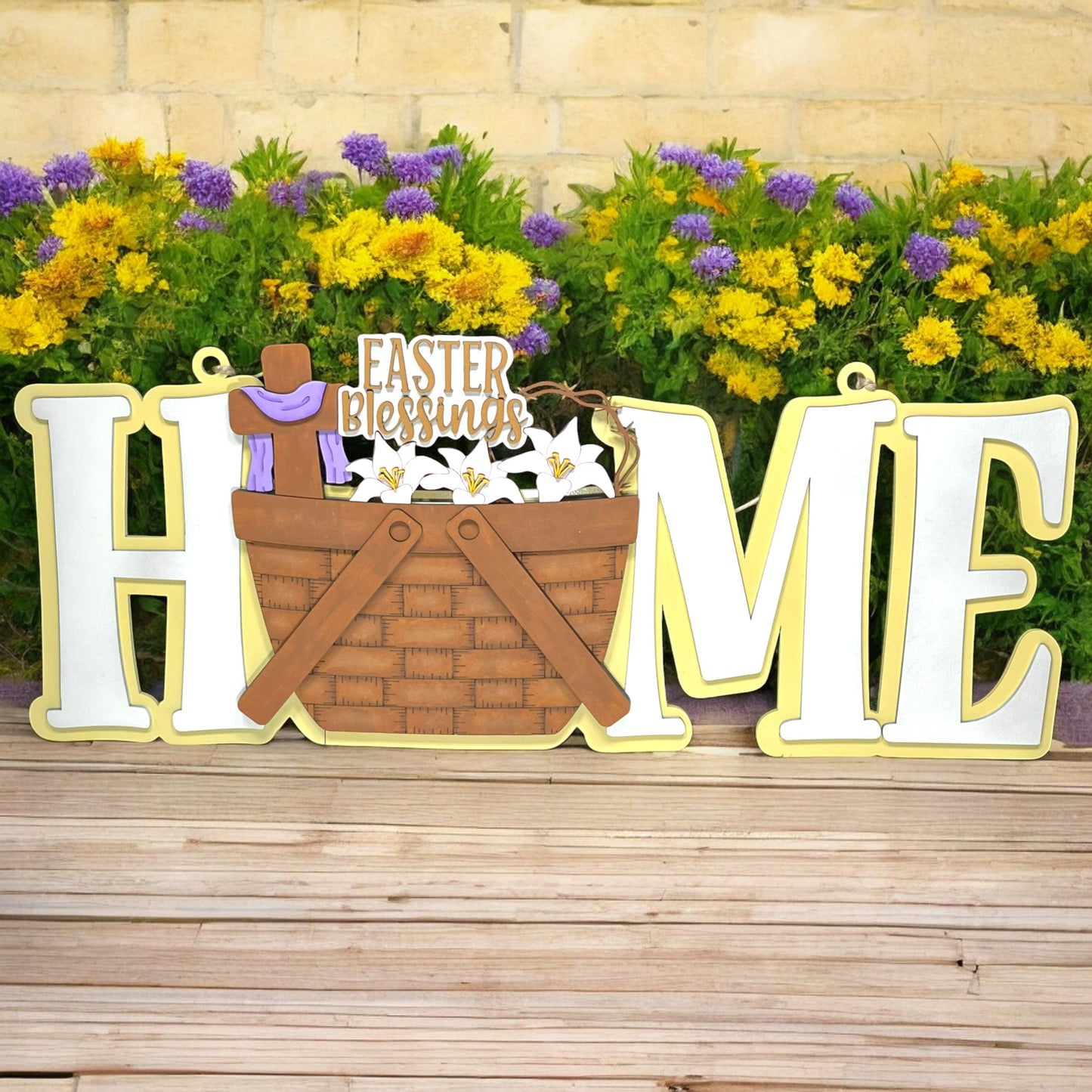 a wooden sign that says home with a basket of flowers