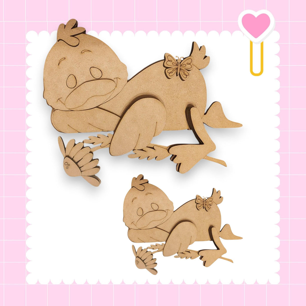two wooden cutouts of cartoon-like animals, one larger and one smaller, set against a pink background with a heart shape.