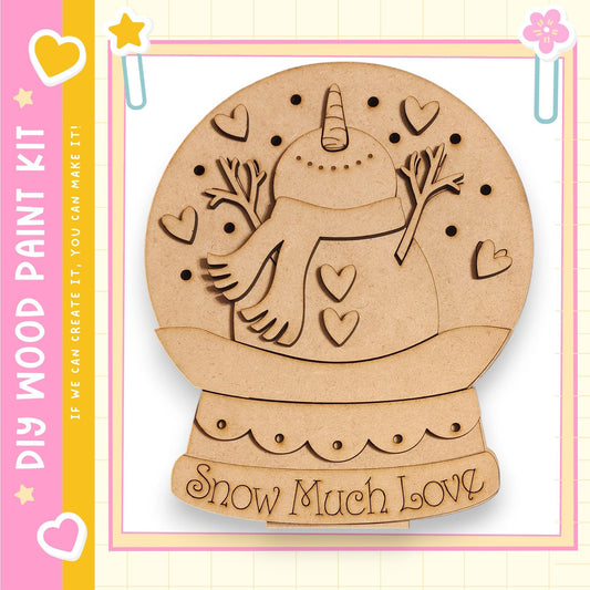 A wooden snow globe kit with a snowman and hearts on it, along with the text "My Wood Paint Kit" and "Snow Much Love" on the kit.