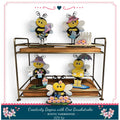 a rustic farmhouse-style DIY kit with a creative theme, including four bee figurines and a wooden tray.