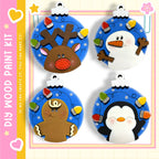 four unique Christmas ornaments, each with a different design and color scheme. The ornaments include a reindeer, a snowman, a gingerbread man, and a penguin. The ornaments are arranged in a square formation, creating a visually appealing display.