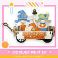 a DIY wood paint kit for creating a pumpkin season decoration, with two gnomes in a wagon holding pumpkins and a sign that says "Pumpkin Season".