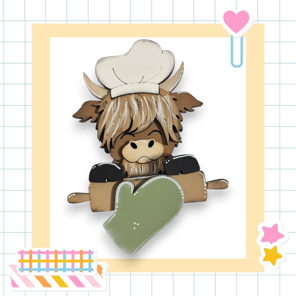 A cartoon cow wearing a chef's hat and holding a rolling pin, surrounded by various kitchen-themed stickers.