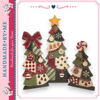 three Christmas tree decorations made of fabric, each with unique patterns and designs. The trees are arranged in a row, creating a festive and decorative display.