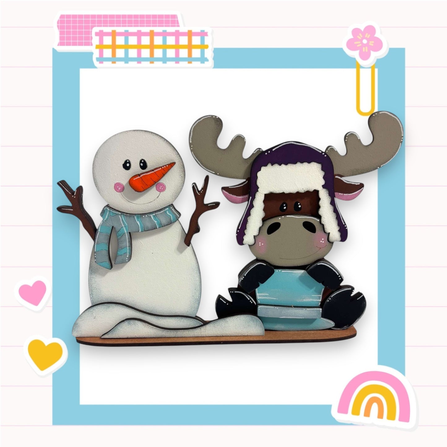 a picture of a snowman and a reindeer on a sled