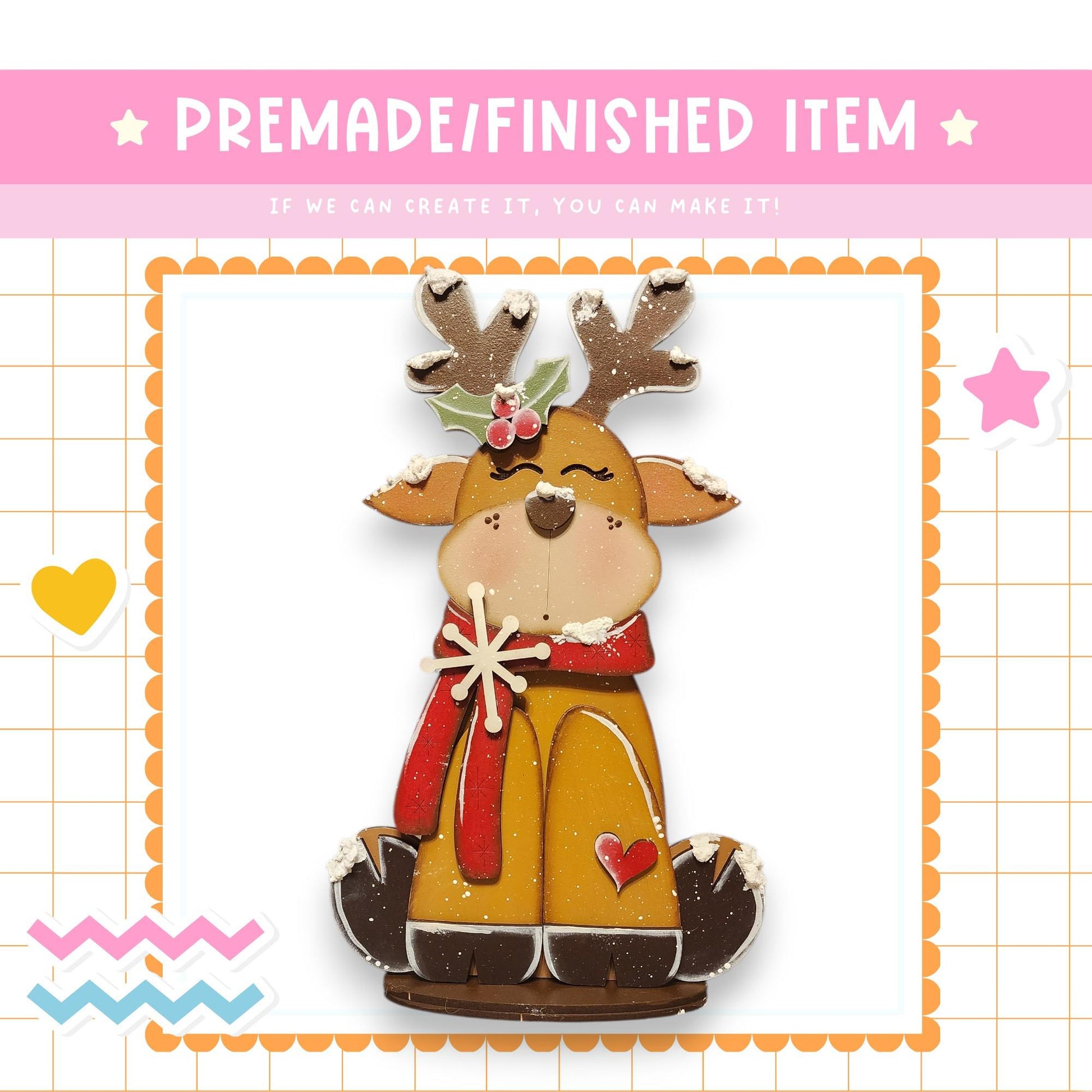 a festive Christmas-themed decoration, including a gingerbread man figure wearing a red scarf and a holly leaf on its head. The gingerbread man is sitting on a gingerbread house base, and the background has a grid pattern.