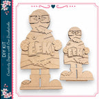 two wooden figures, one larger and one smaller, both holding a sign that says "EEEK!"