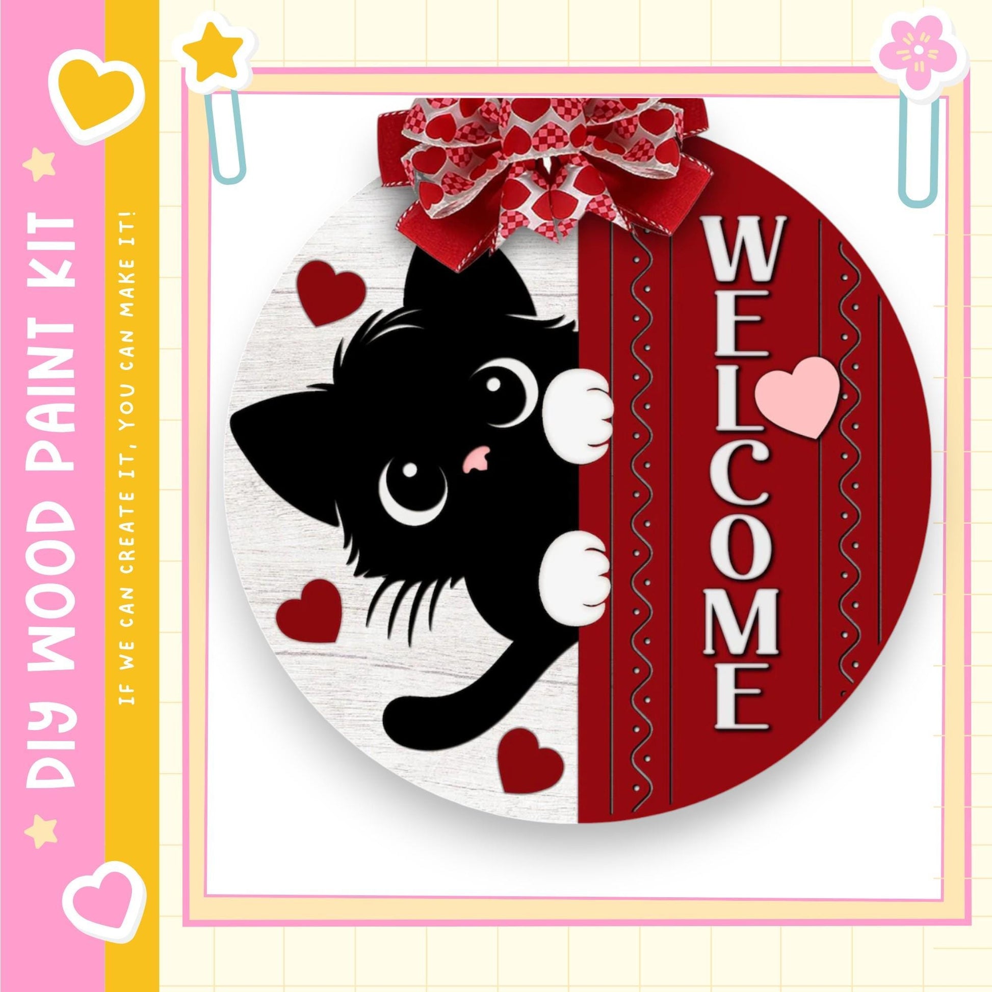 A black cat with white paws is peeking out from behind a red and white striped frame, with hearts and a bow around the frame.
